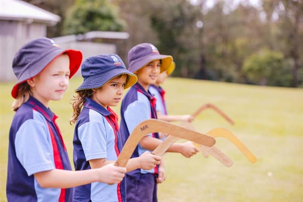 Students throwing boomerangs
