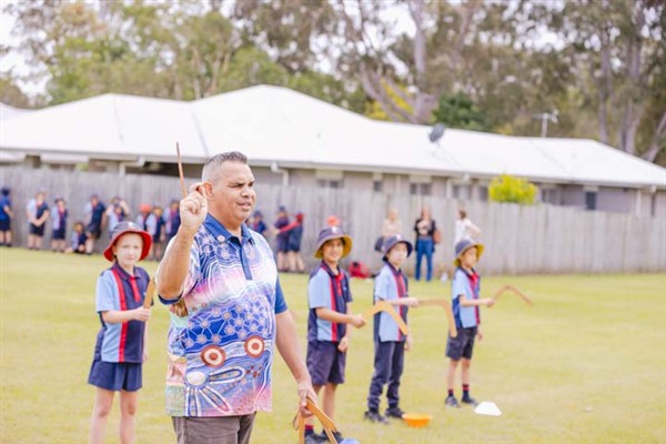 Ngutana Lui Cultural Tutor showing students how to stand to throw the boomerang