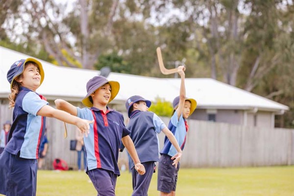 Students mid-boomerang throw