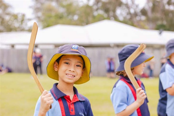 Students learning to throw boomerangs.