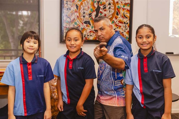 Cultural Tutor Marlon Riley with students