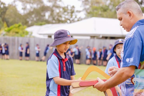 Students learning about using boomerangs